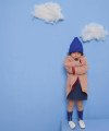 blush quilted overcoat and blue knit hat