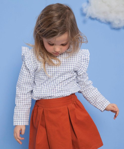 Frilly sleeve blouse and rust box skirt